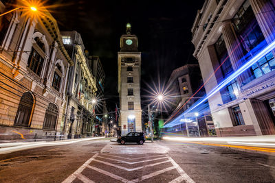 View of illuminated street at night