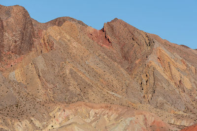 Low angle landscape of barren yellow toned hillside in lake mead national recreation area in nevada