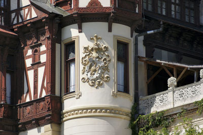 Low angle view of statue against historic building