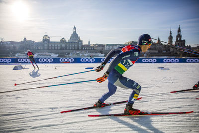 Full length of people skiing on snow