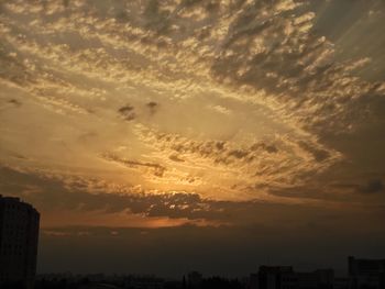Scenic view of silhouette buildings against sky during sunset