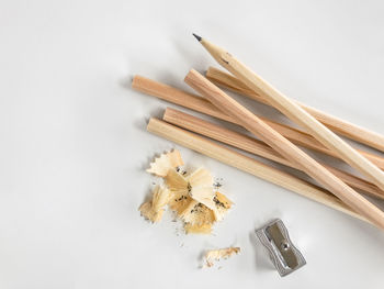 High angle view of school supplies on white background