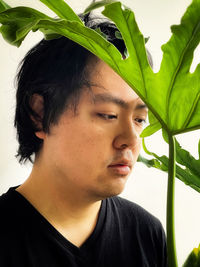 Close-up portrait of young man looking away