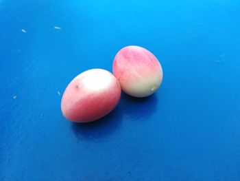 High angle view of apple against blue background