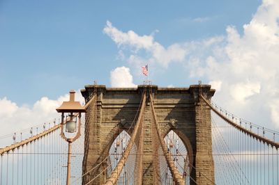 Low angle view of brooklyn bridge against sky