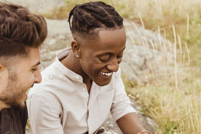 Young couple with hands on land