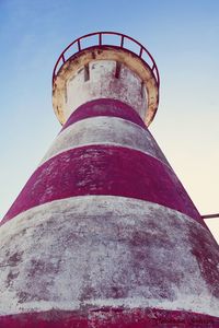 Low angle view of lighthouse against blue sky