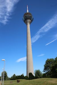 Low angle view of tower against cloudy sky
