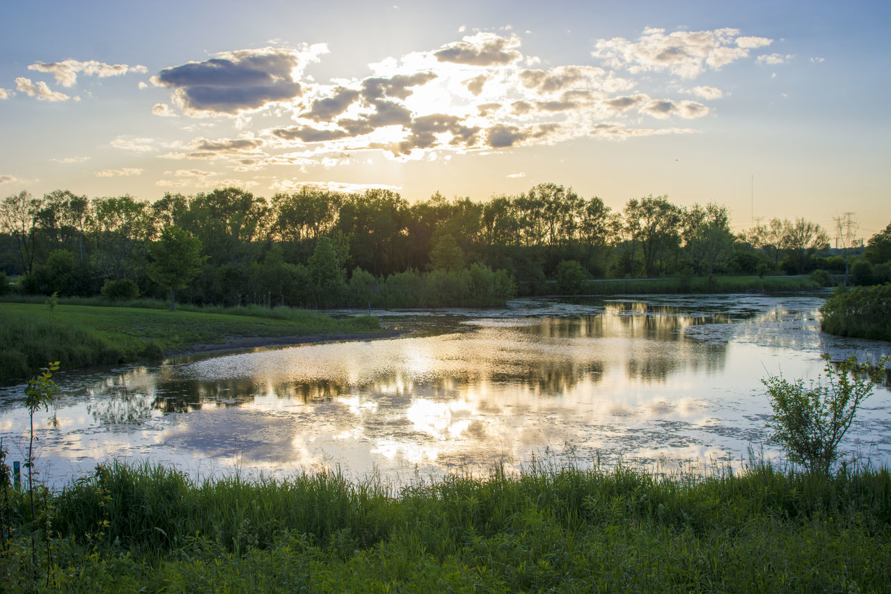 SCENIC VIEW OF LAKE AGAINST SKY DURING SUNSET