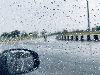 Water drops on car window during rainy season