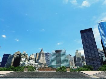 Low angle view of skyscrapers against sky