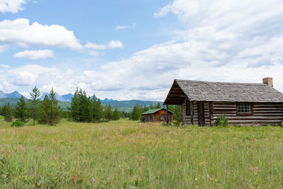 House on field against sky