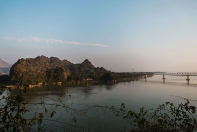 Scenic view of bridge over river against sky