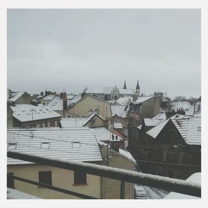 Houses in town against sky
