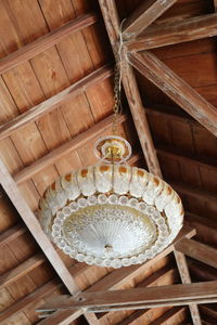 High angle view of electric lamp hanging on ceiling