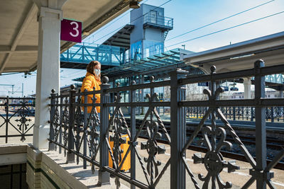 Low angle view of woman on railroad station