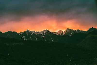 Scenic view of mountains against sky during sunset