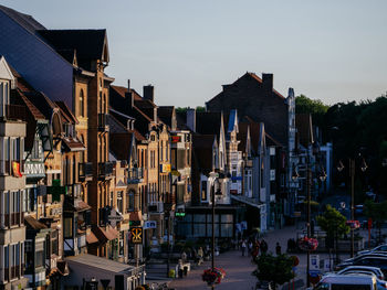 City street and buildings against sky