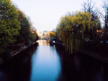 Bridge over river with buildings in background