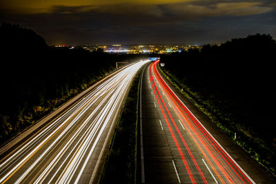 High angle view of light trails on road at night