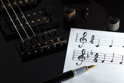 High angle view of guitar on table