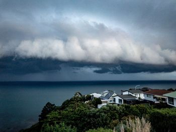 Scenic view of sea and buildings against sky