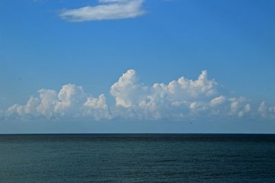 Scenic view of sea against blue sky