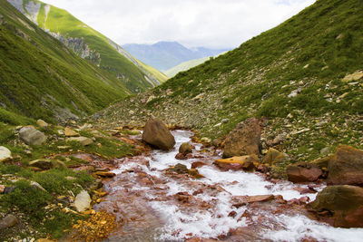 Mountain river landscape, red river, in khazbegi, georgia