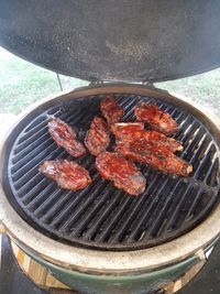 High angle view of meat on barbecue