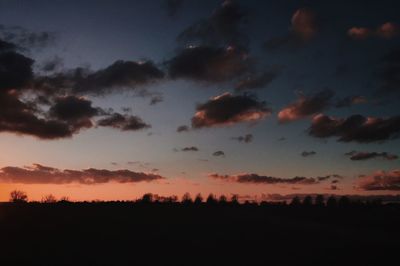 Silhouette of landscape against dramatic sky