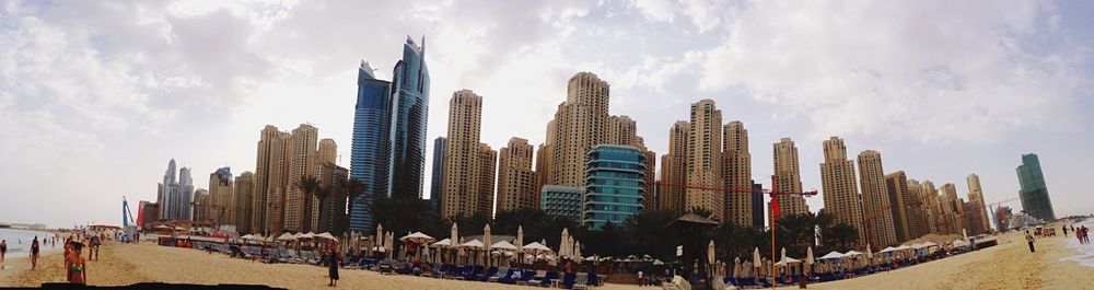 City skyline against cloudy sky