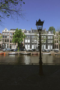 View of buildings in city against clear sky