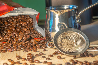 Close-up of coffee beans on table