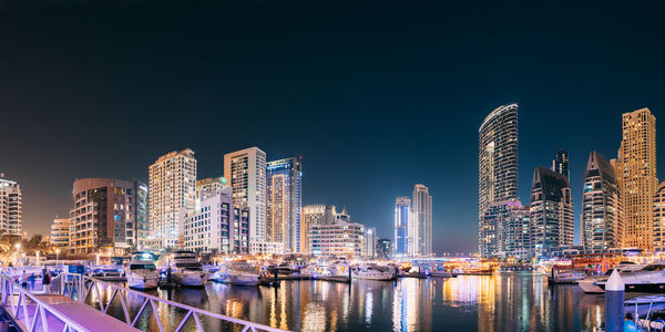 Illuminated buildings in city at night