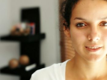 Portrait of young woman at home