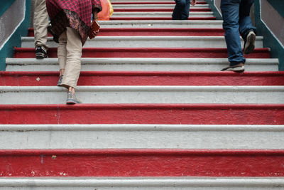 People walking up the stairs of sri subramaniam temple