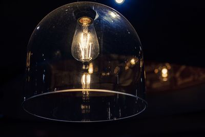 Close-up of illuminated light bulb