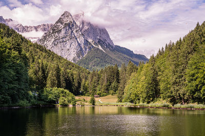 View of bavarian alps reflected by a scenic lake