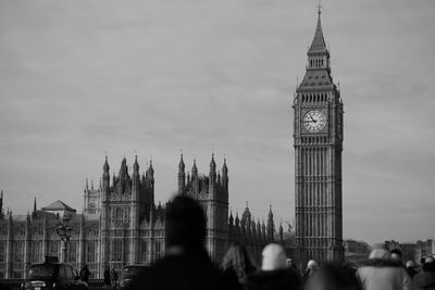 View of clock tower against sky in city