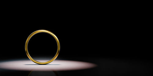 Close-up of wedding rings against black background