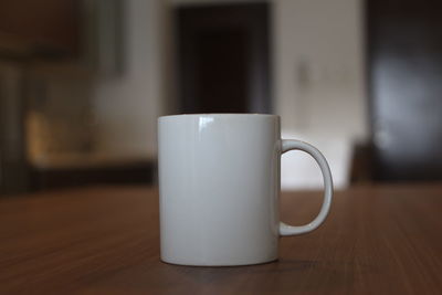 Close-up of coffee cup on table