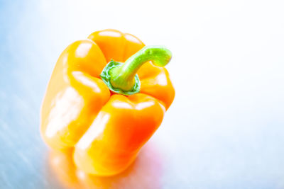 Close-up of yellow bell peppers against white background