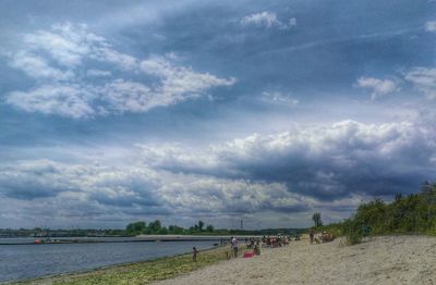 Scenic view of sea against cloudy sky