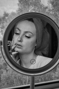 Close-up portrait of woman with reflection