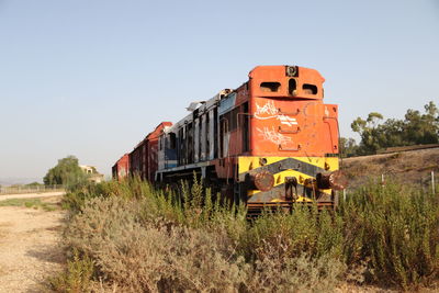 Train on railroad track against sky