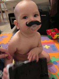 Close-up portrait of cute baby at home