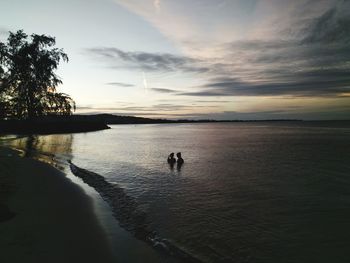 Scenic view of beach against sky during sunset