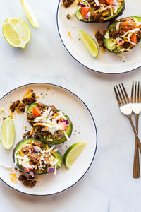 Delicious and creamy taco style avocado boats, ready for eating.