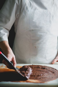 Close-up of chef making chocolate dessert
