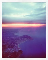 Aerial view of sea at sunset